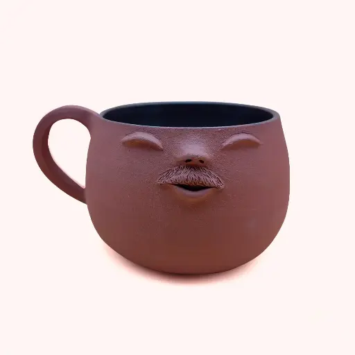 Tasse visage avec anse